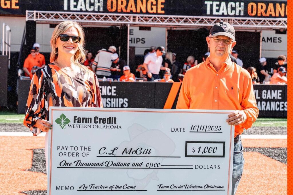 Julie Jackson presenting a check to C.L. McGill