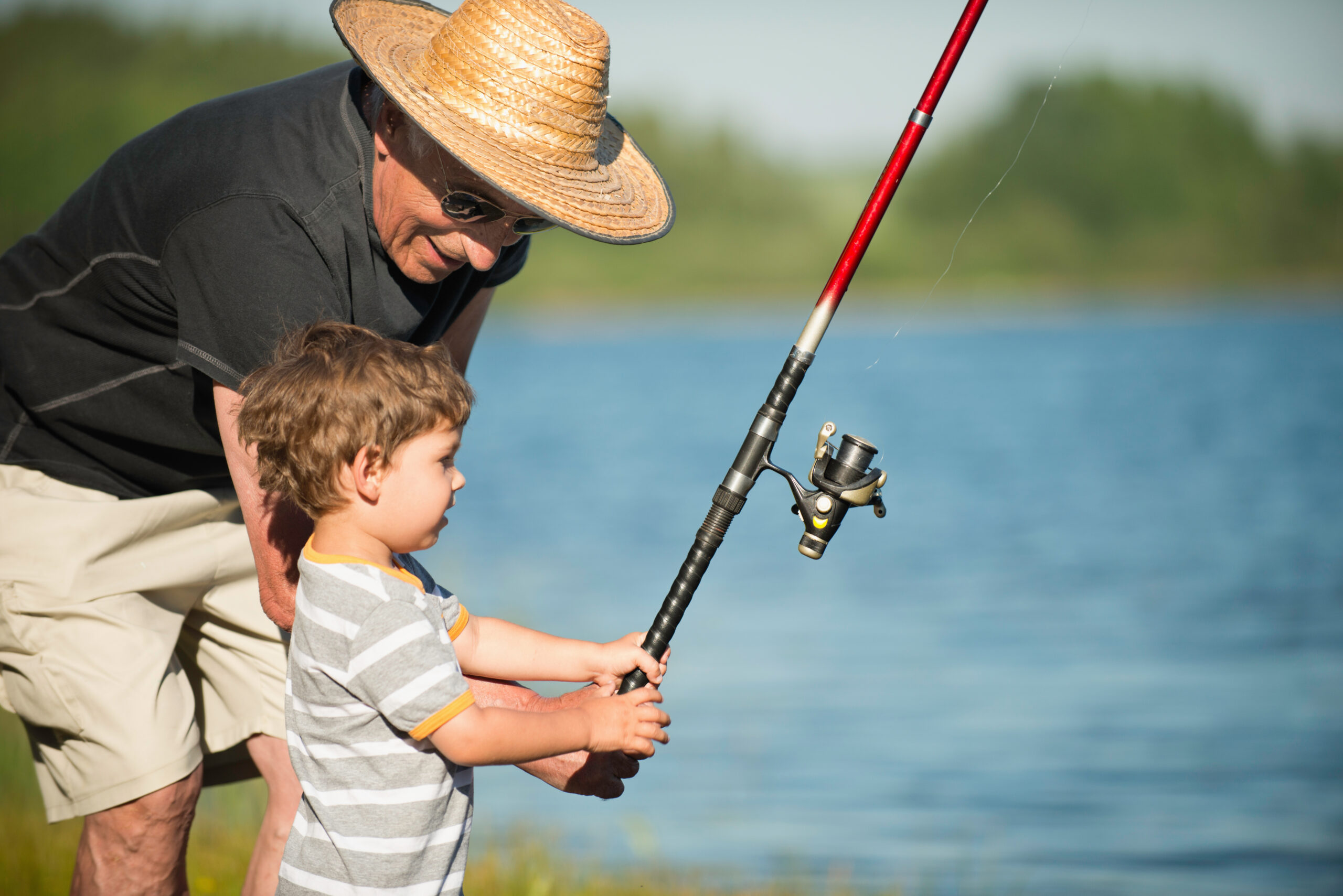 cute,little,boy,fishing,with,his,grandfather